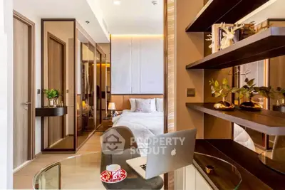 Modern bedroom with stylish decor and workspace, featuring elegant shelving and cozy ambiance.