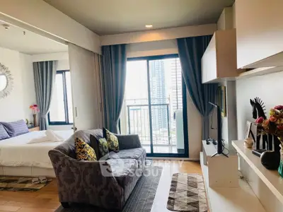 Modern studio apartment with stylish decor and city view balcony