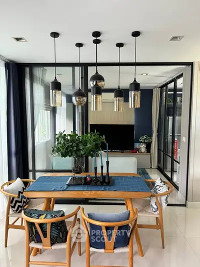 Modern dining area with stylish pendant lights and elegant decor