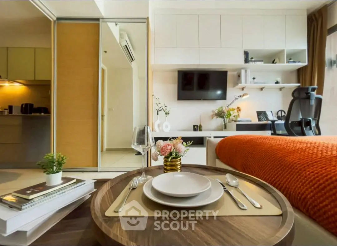Modern studio apartment with cozy living area and stylish decor
