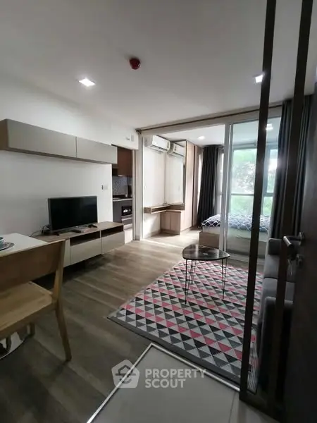 Modern open-plan living room with stylish decor and natural light