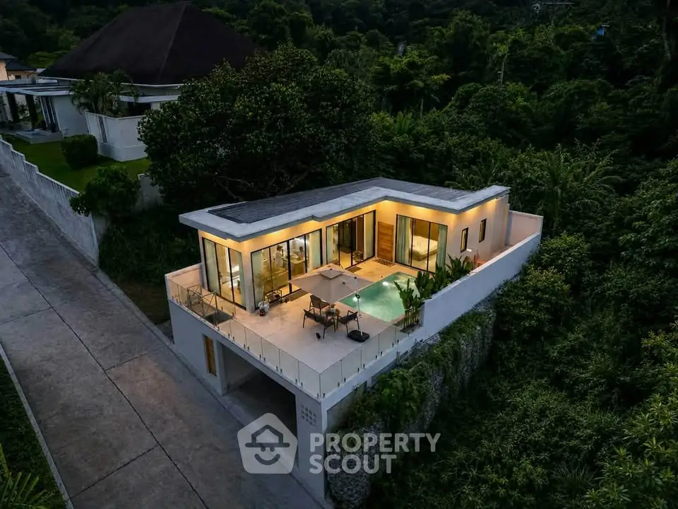 Luxurious modern villa with private pool and lush greenery, perfect for serene living.