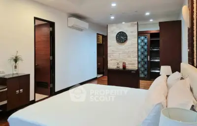 Spacious modern bedroom with elegant decor and walk-in closet