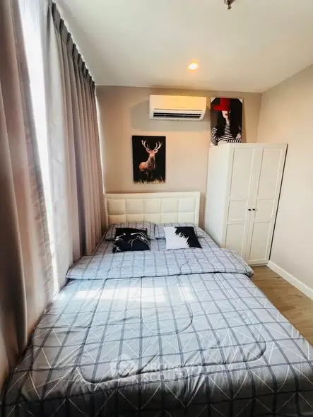 Cozy bedroom with stylish decor and natural light