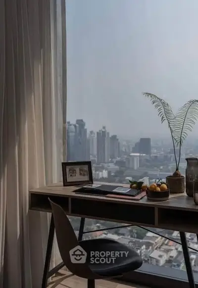 Modern study area with city view, featuring sleek desk and chair, perfect for urban living.