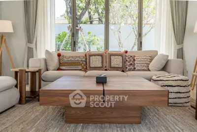 Stylish living room with modern wooden coffee table and cozy sofa, perfect for relaxation.