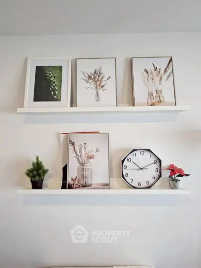 Stylish wall shelves with framed art and decor in modern living room.