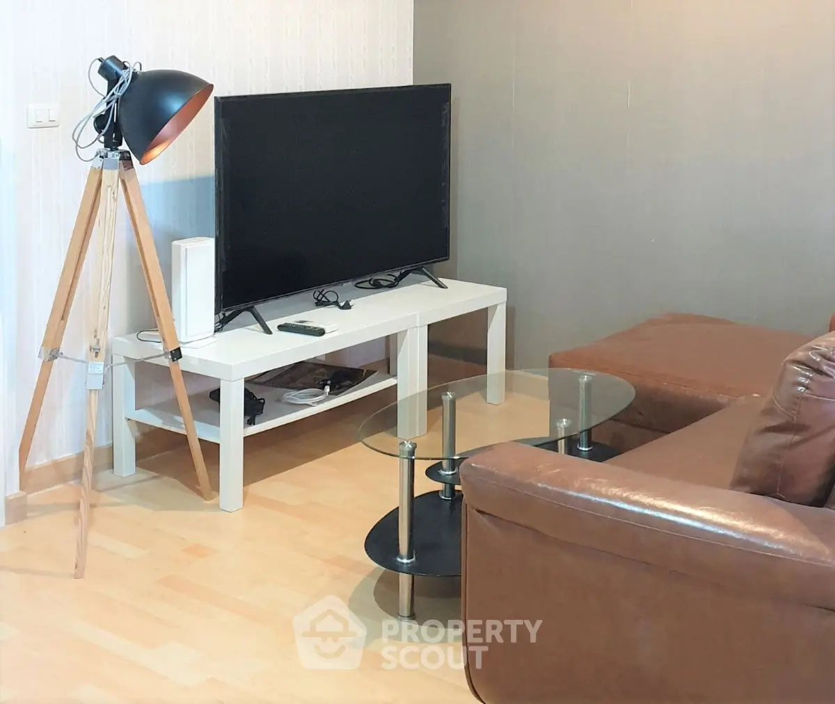 Cozy living room with modern TV setup and stylish lighting