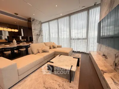 Luxurious modern living room with marble accents and panoramic city view.