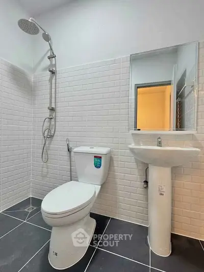 Modern bathroom with sleek fixtures and white subway tiles