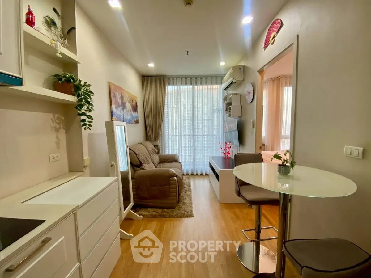 Charming living room with cozy seating and modern decor, featuring natural light and stylish furnishings.