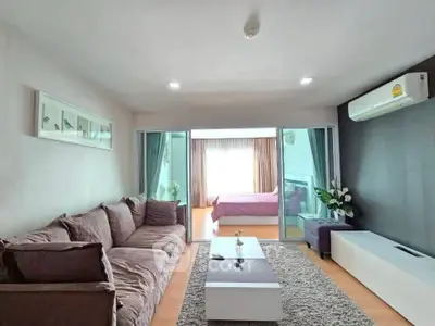 Spacious living room with modern decor and cozy ambiance