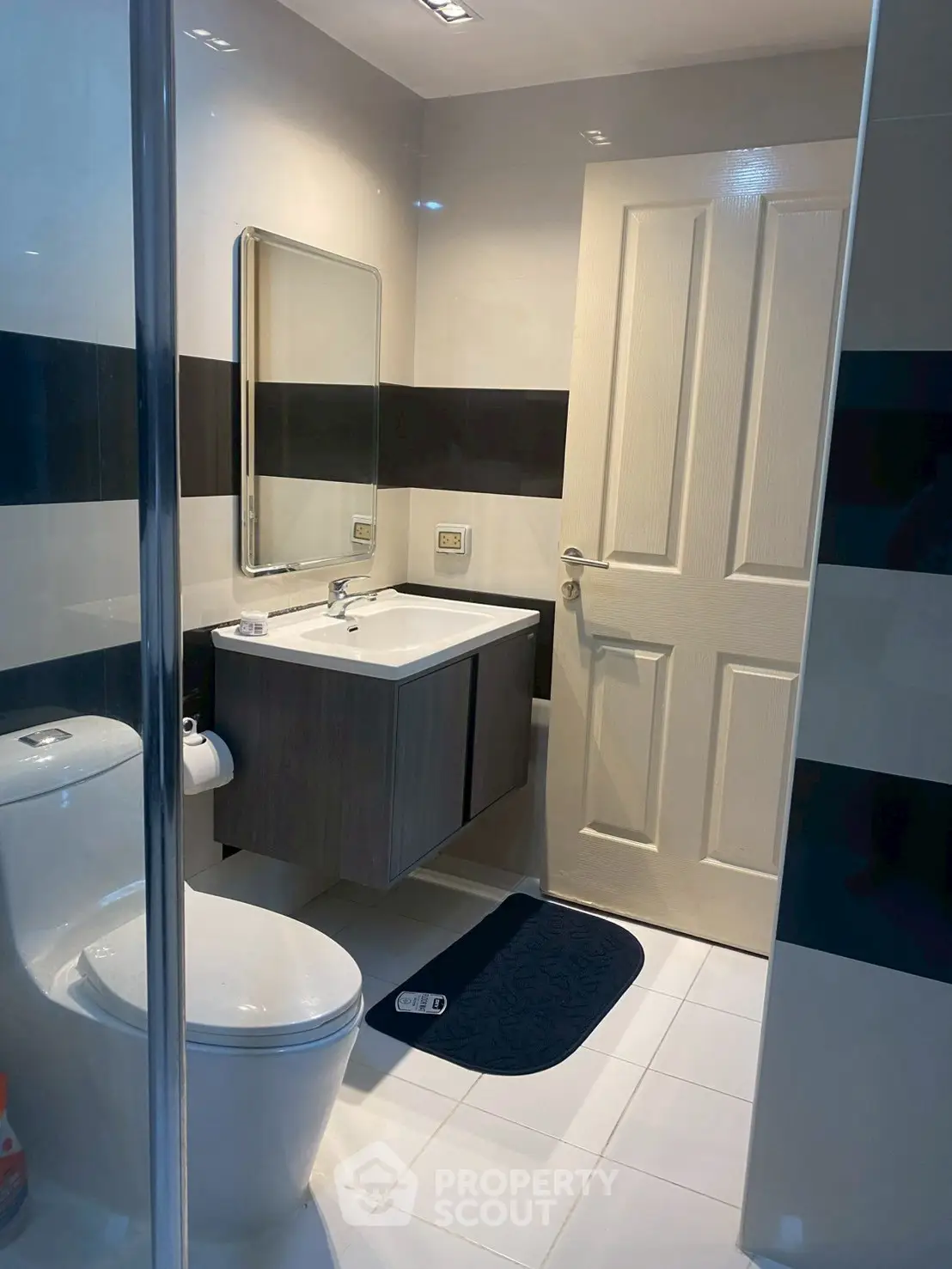 Modern bathroom with sleek fixtures and stylish black and white design