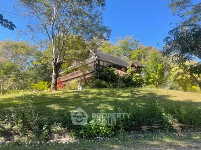 Charming hillside home with lush garden and traditional architecture