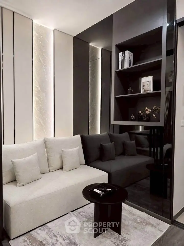 Modern living room with sleek design, featuring a cozy sofa, stylish shelving, and elegant lighting.