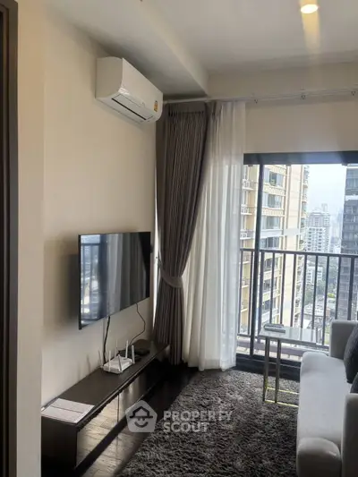 Modern living room with city view, sleek TV setup, and cozy ambiance.