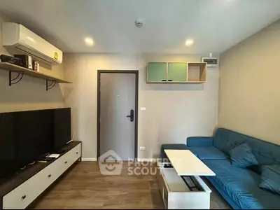 Modern living room with stylish furniture and air conditioning, perfect for comfortable living.