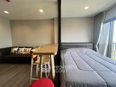 Modern studio apartment with cozy living area and stylish decor