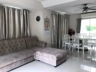 Spacious living room with elegant dining area and modern decor