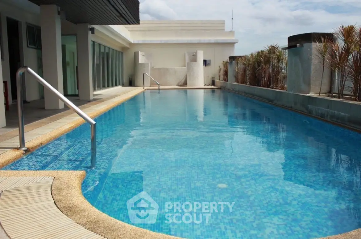 Luxurious rooftop pool with modern design and city views, perfect for relaxation and leisure.