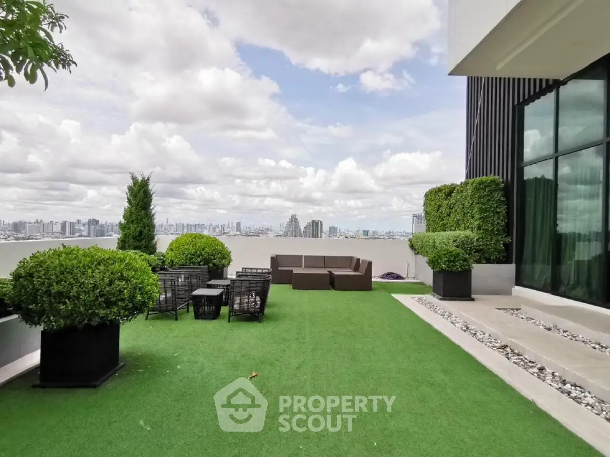 Stunning rooftop terrace with panoramic city views and modern outdoor seating.