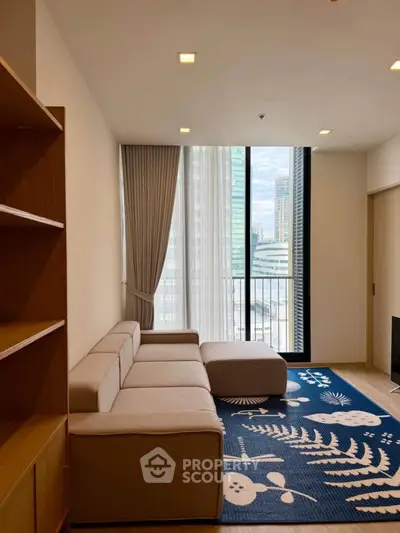 Modern living room with stylish sofa and city view from balcony, perfect for urban living.