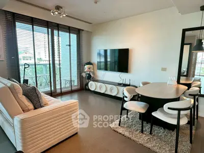 Stylish modern living room with sleek furniture and large windows