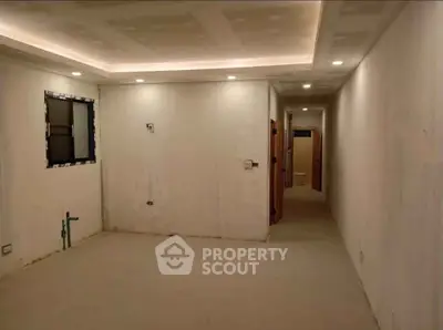 Spacious unfinished room with recessed lighting and potential for customization.