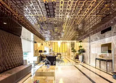 Luxurious hotel lobby with elegant decor and plush seating
