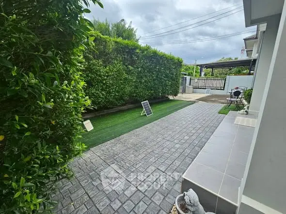Charming garden view with lush greenery and spacious patio area.
