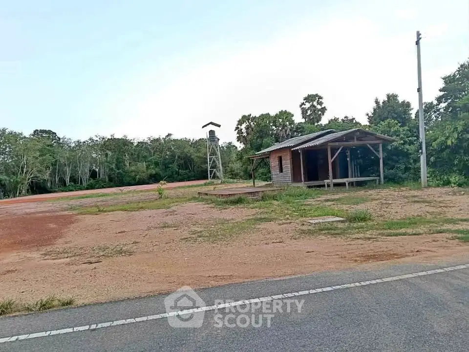 Rustic cabin with surrounding greenery and open land, ideal for nature lovers seeking tranquility.