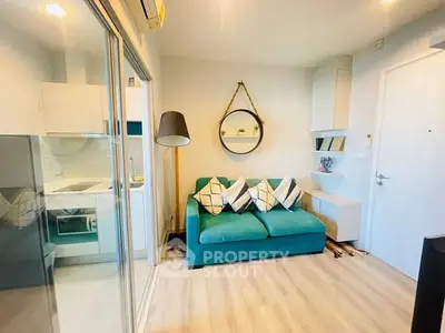 Chic modern living room with teal sofa and stylish decor