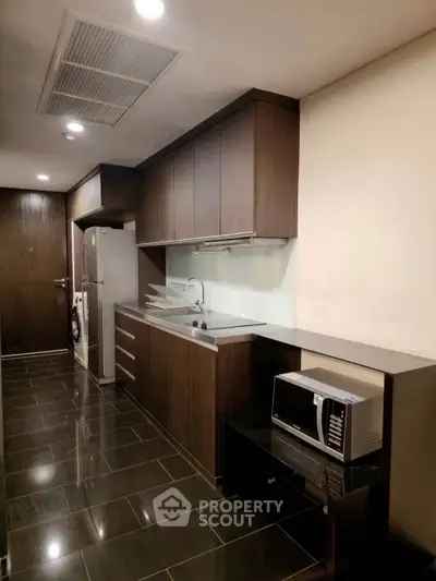 Modern kitchen with sleek cabinetry and stainless steel appliances