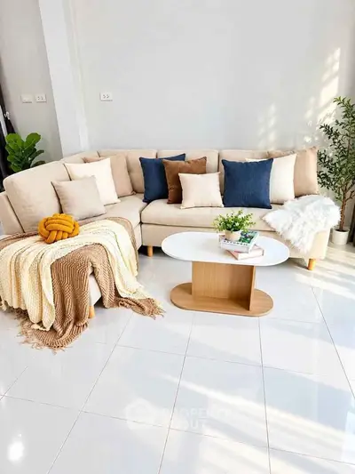 Stylish living room with cozy beige sectional sofa and modern coffee table, perfect for relaxation.