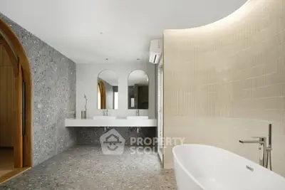 Luxurious modern bathroom with freestanding tub and dual sinks