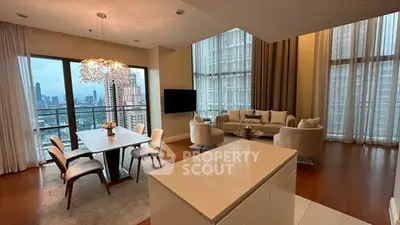Luxurious high-rise living room with stunning city view and elegant furnishings.