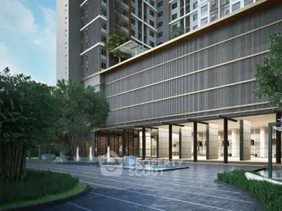 Modern apartment building entrance with sleek design and lush greenery