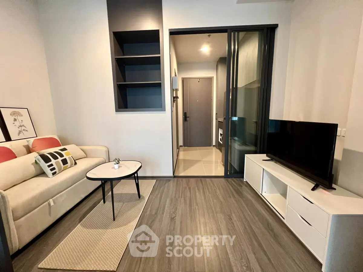 Modern living room with sleek furniture and stylish decor in a contemporary apartment.