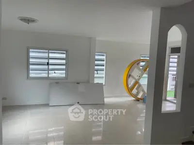 Spacious unfurnished living room with large windows and modern design
