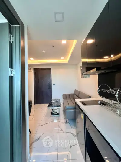 Modern apartment interior with sleek kitchen and cozy living area