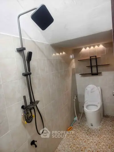 Modern bathroom with sleek shower and stylish lighting
