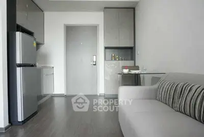 Modern compact living room with kitchenette and sleek design