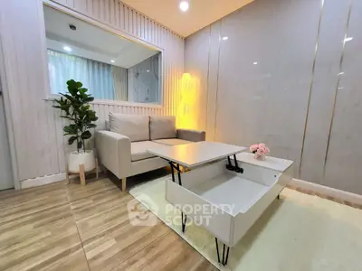 Modern living room with stylish furniture and elegant lighting