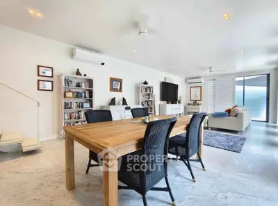 Spacious modern living room with elegant dining area and stylish decor