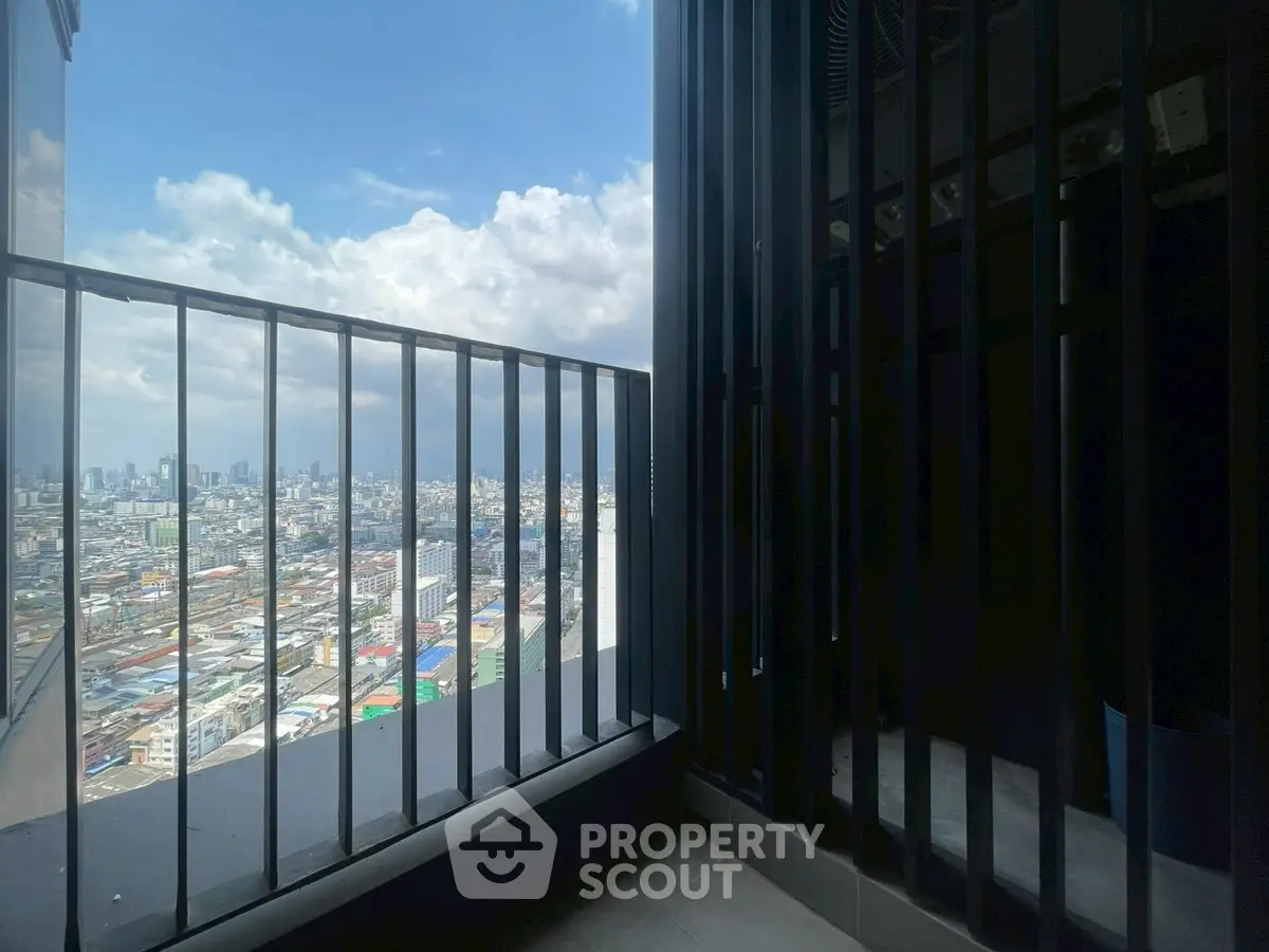 Stunning cityscape view from a modern high-rise balcony, perfect for urban living enthusiasts.