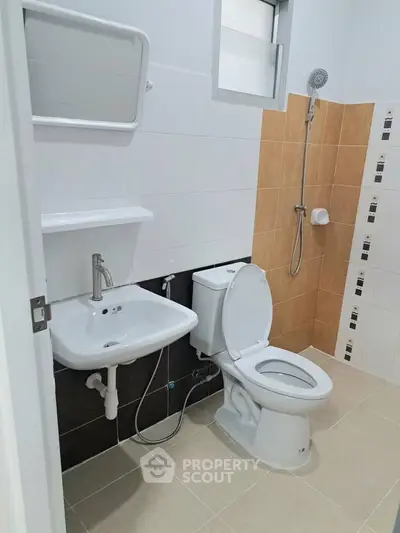 Modern bathroom with shower and toilet in a stylish apartment.