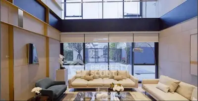Luxurious living room with large windows and modern decor