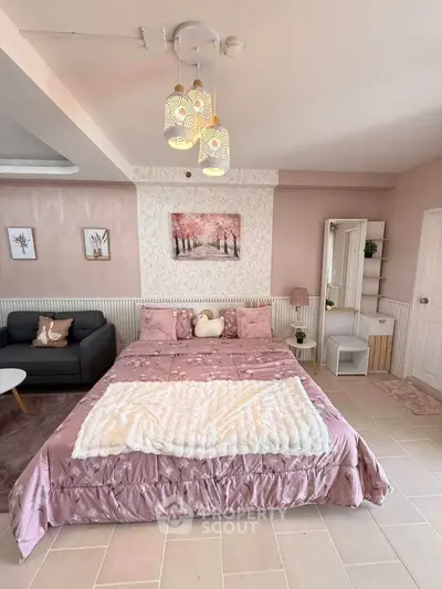 Charming bedroom with elegant decor and cozy ambiance, featuring a plush bed and stylish lighting.