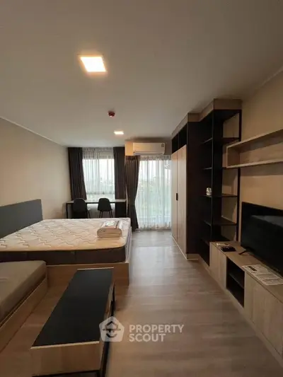 Modern studio apartment with sleek design and ample natural light