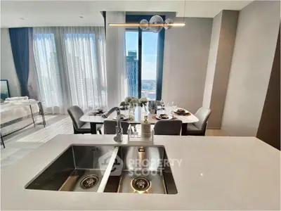 Luxurious open-plan kitchen and dining area with stunning city view, modern fixtures, and elegant decor.